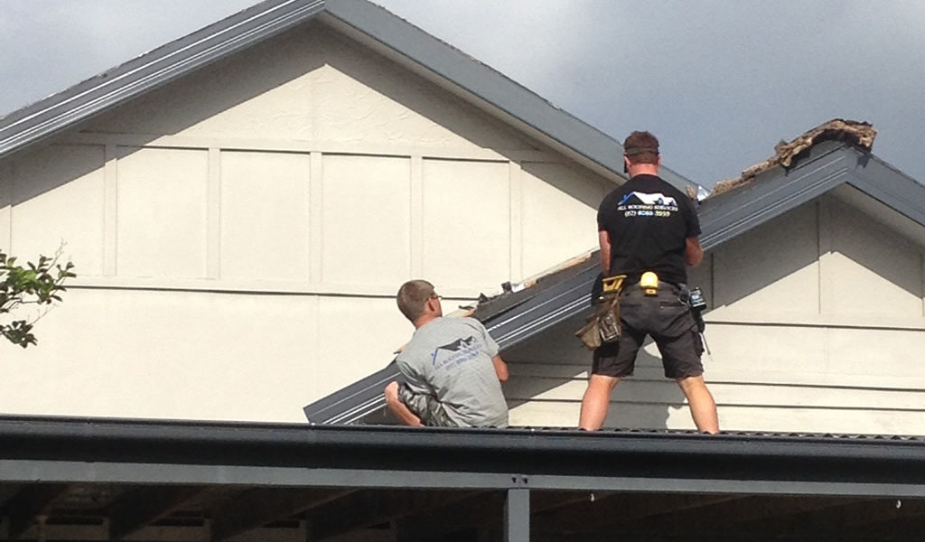 Roofers on a roof.